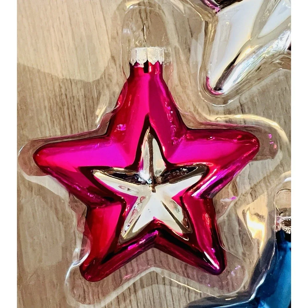 Handcrafted Glass Ornament Set features four star-shaped ornaments metallic
